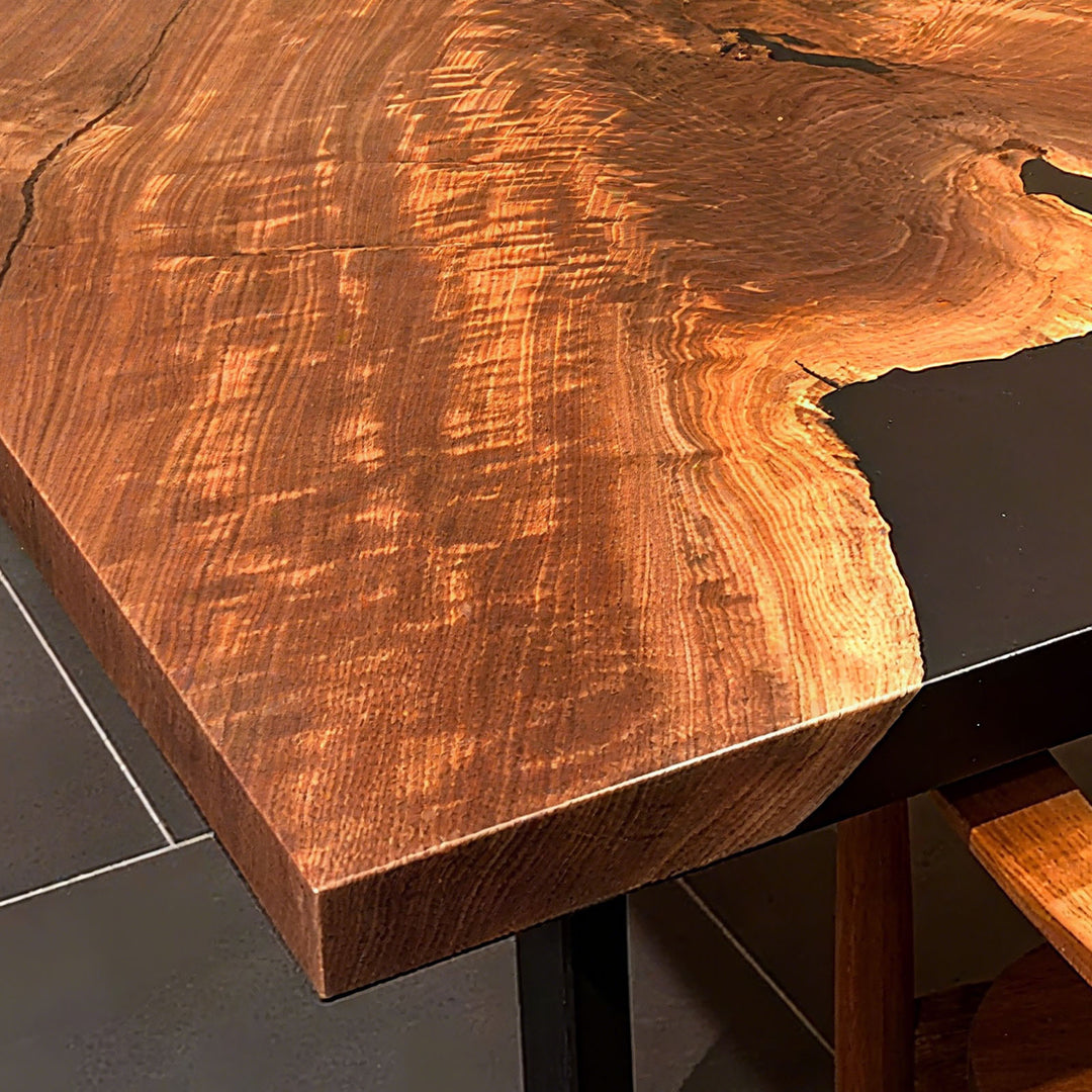 Epoxy resin river table highlighting natural wood patterns