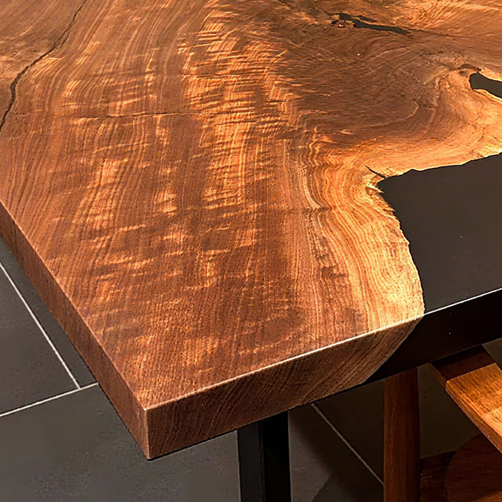 Epoxy resin river table highlighting natural wood patterns