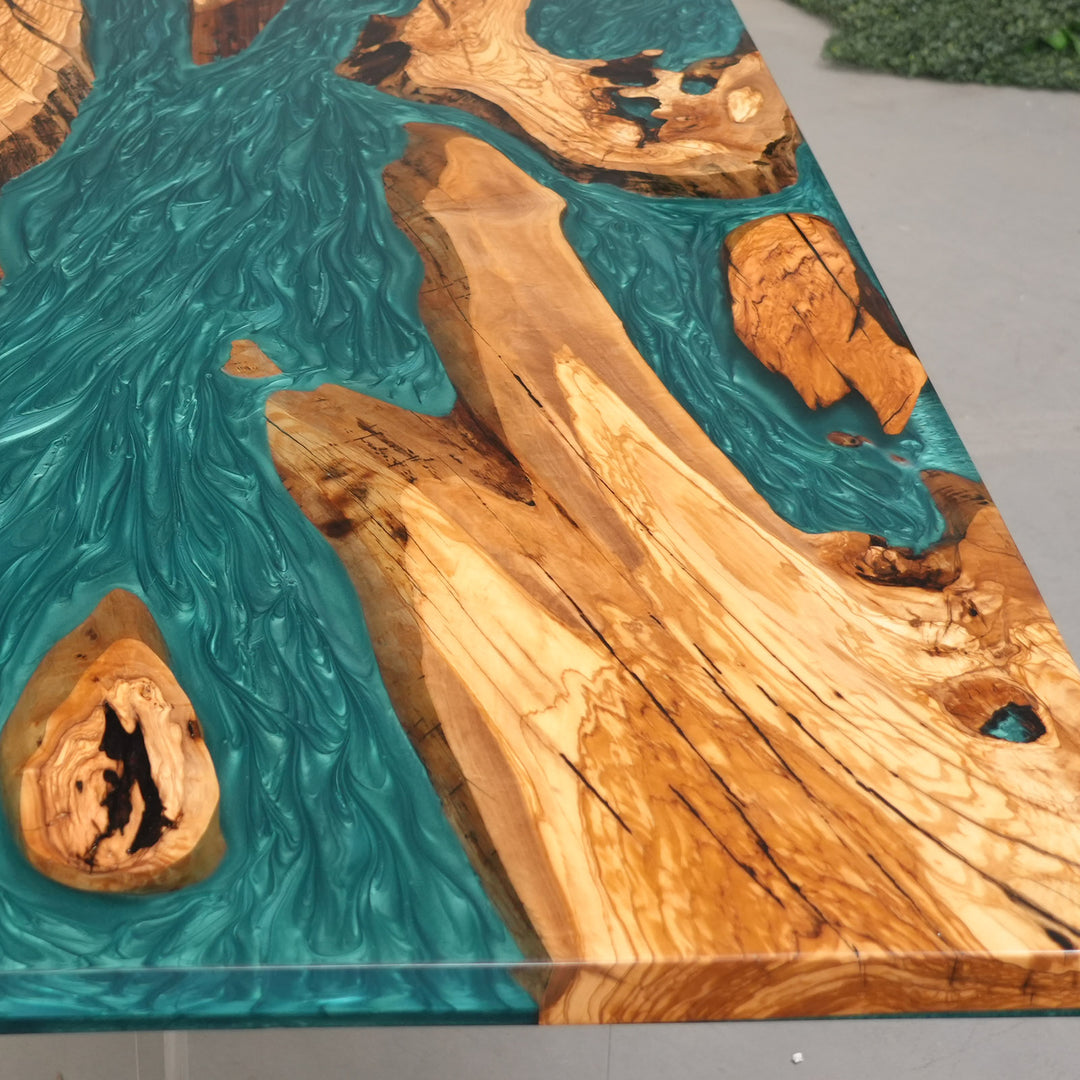Luxury statement furniture: Teal epoxy river table for modern open-concept living.
