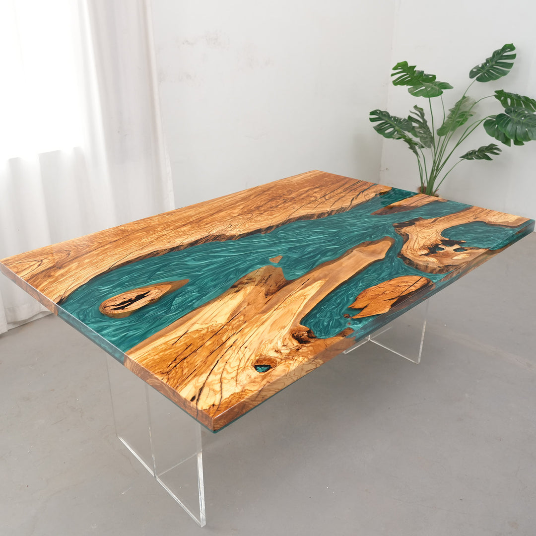 Modern organic dining table featuring shimmering teal epoxy and natural wood grain.