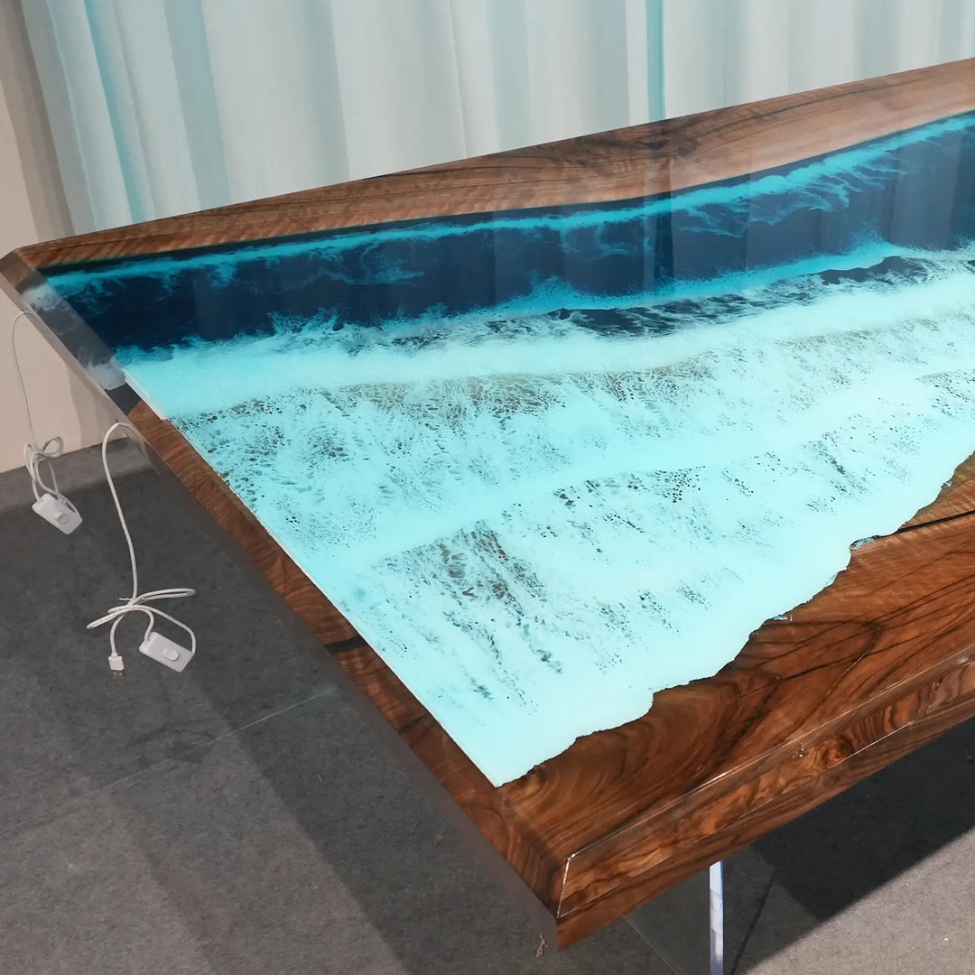 Rectangular black walnut dining table featuring layered blue resin, white wave accents, and LED lighting