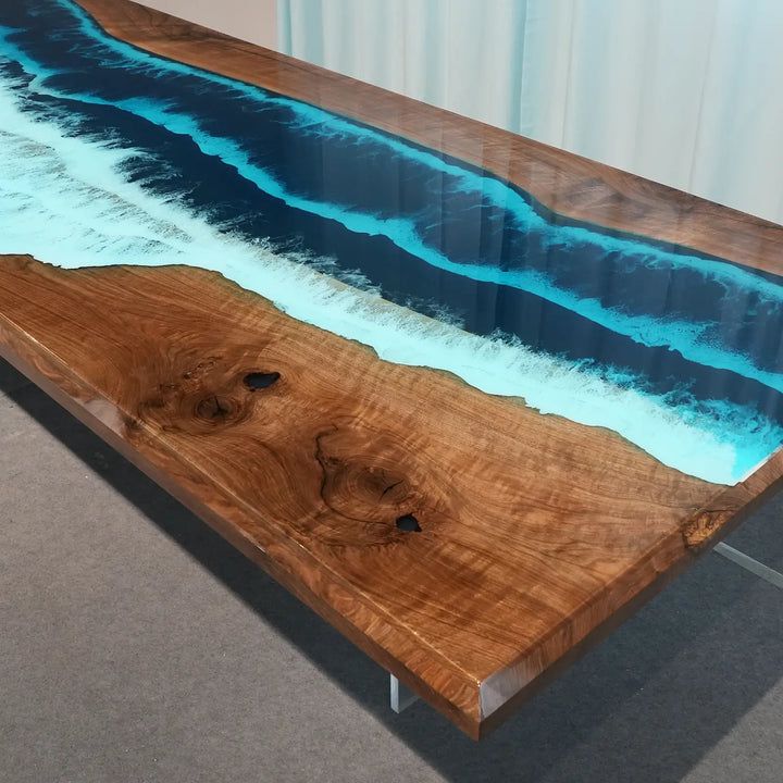Ocean-inspired black walnut dining table with glossy turquoise resin and deep navy blue details