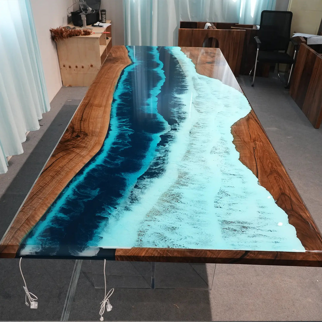 Malibu coastal style epoxy dining table with deep blue ocean patterns and solid black walnut slabs