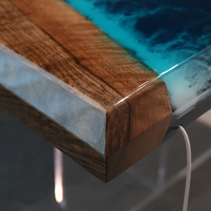 Custom ocean blue epoxy resin black walnut dining table for contemporary coastal interiors