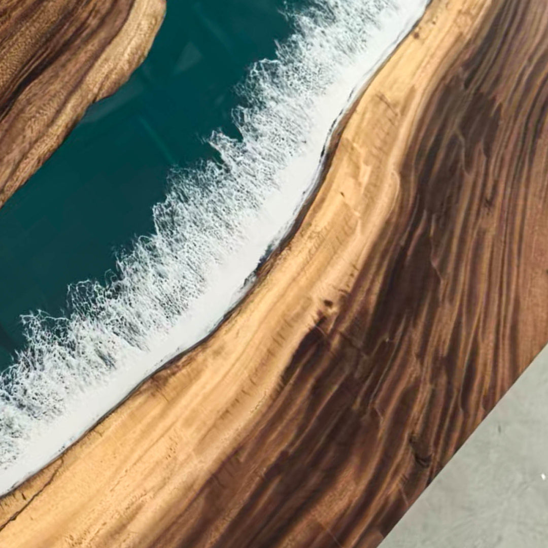 High-end coastal modern dining table with straight edge walnut and vivid ocean wave epoxy design.