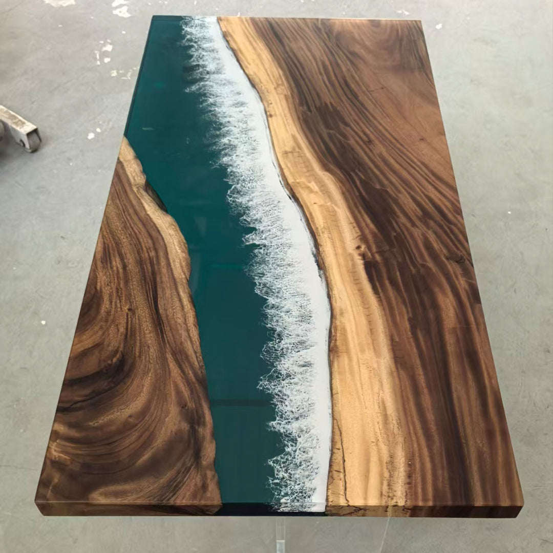 Elegant resin river table, inspired by Malibu ocean waves, perfect for modern dining spaces.
