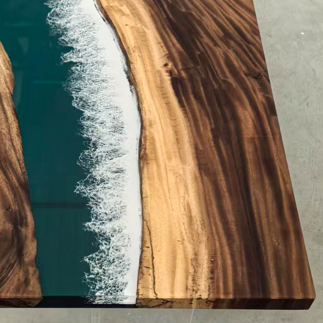 Close-up of ocean wave resin detail on Malibu Luxury walnut dining table.