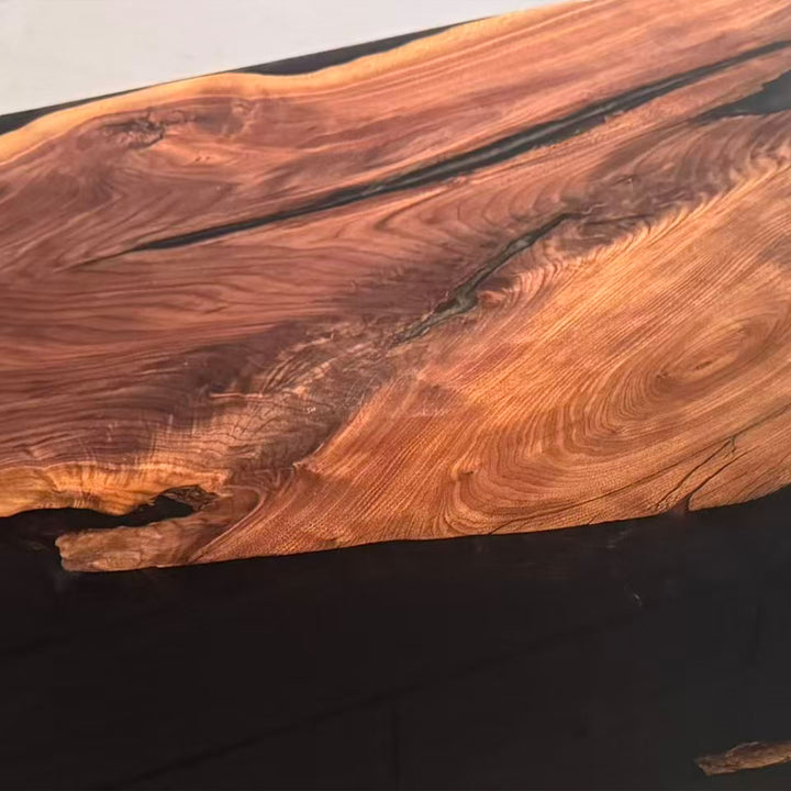 Detail of beveled edges and curved corners on a premium black walnut resin centerpiece.