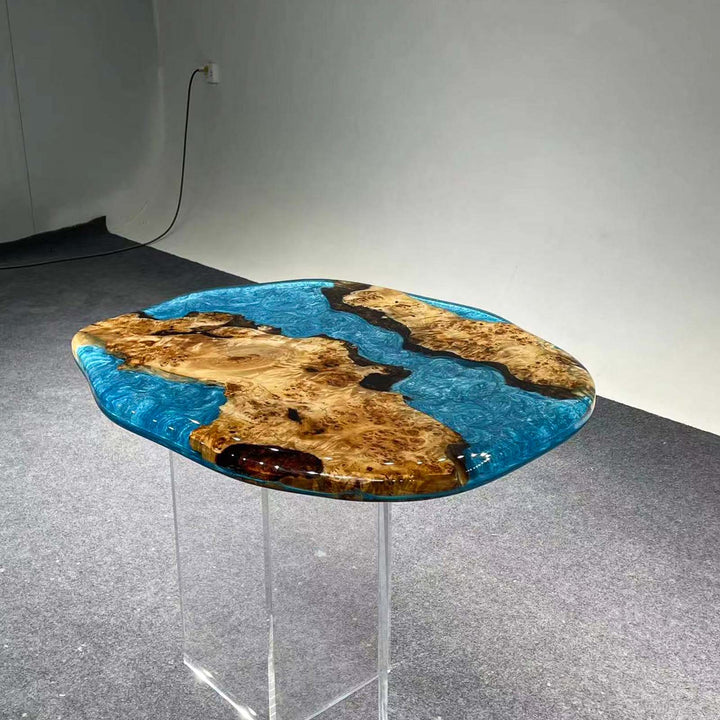 Handcrafted epoxy resin table with natural poplar wood grain and coastal-blue river design.