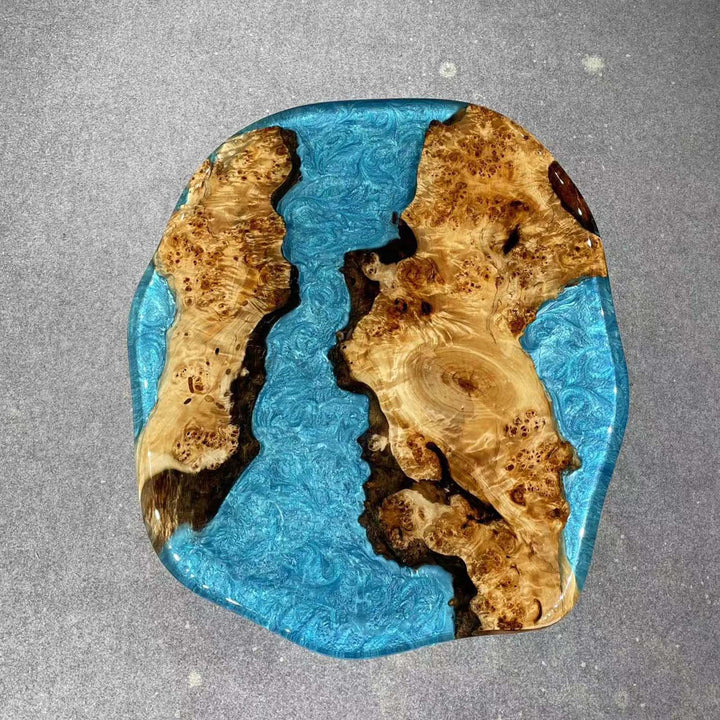 Artistic ocean-wave epoxy coffee table made from poplar wood and blue resin.