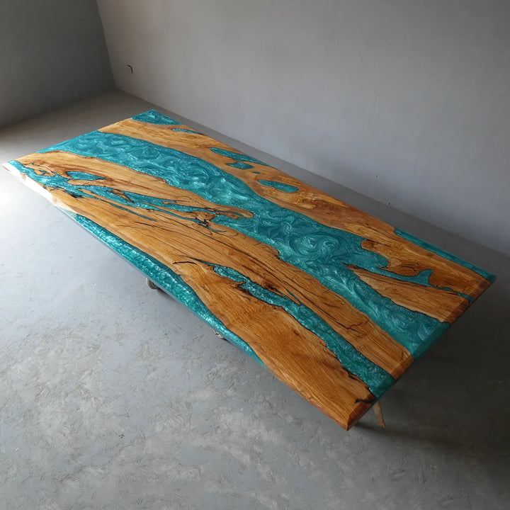 Miami-inspired epoxy resin dining table with shimmering turquoise river