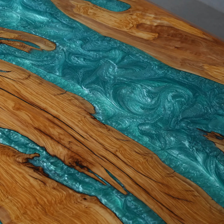 Modern coastal dining table featuring turquoise epoxy and natural wood