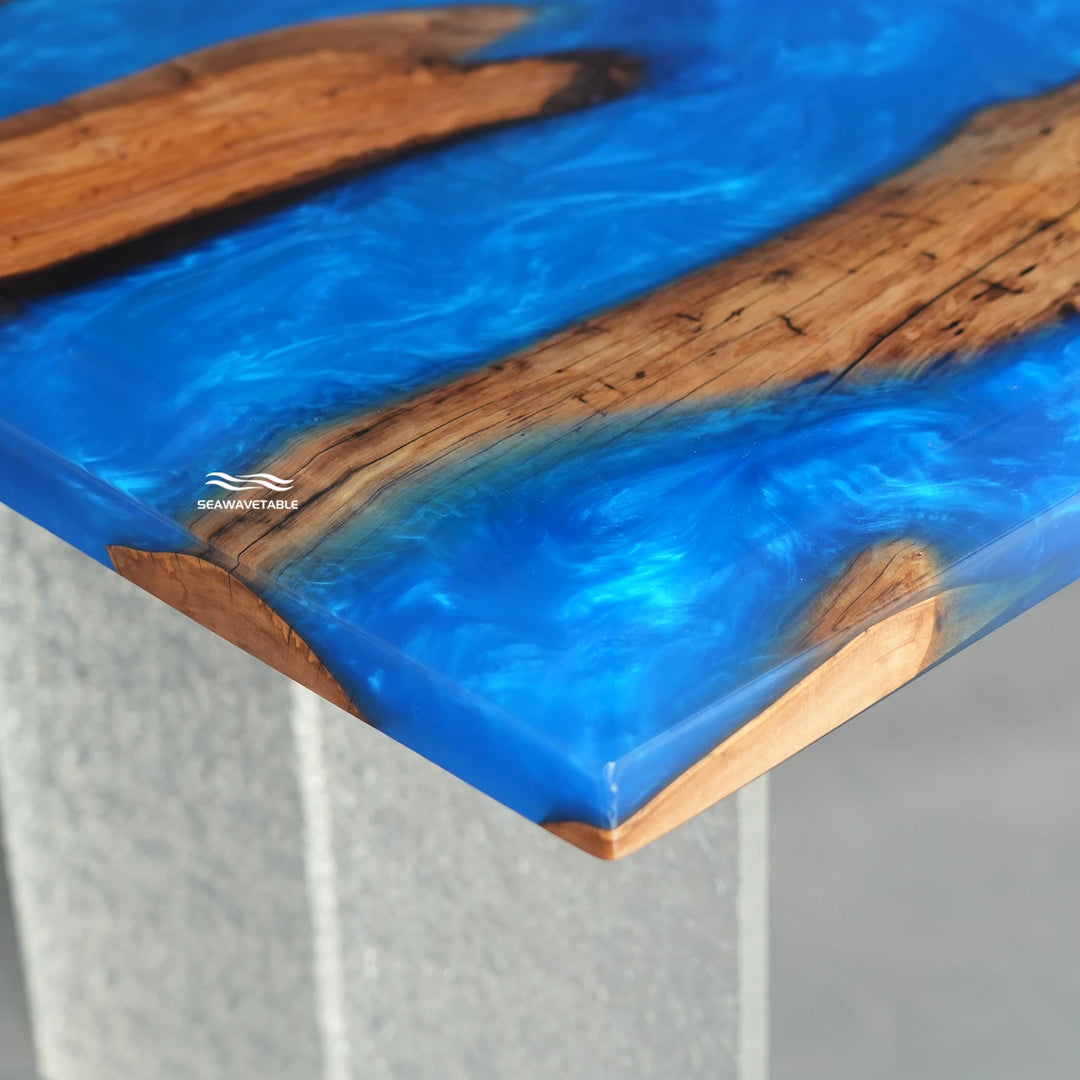 Bespoke ocean-inspired epoxy dining table with sculptural wood edges