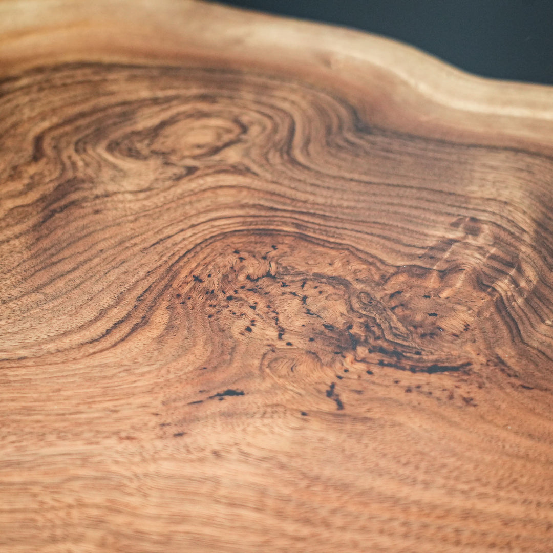 Statement black walnut river table for upscale dining spaces