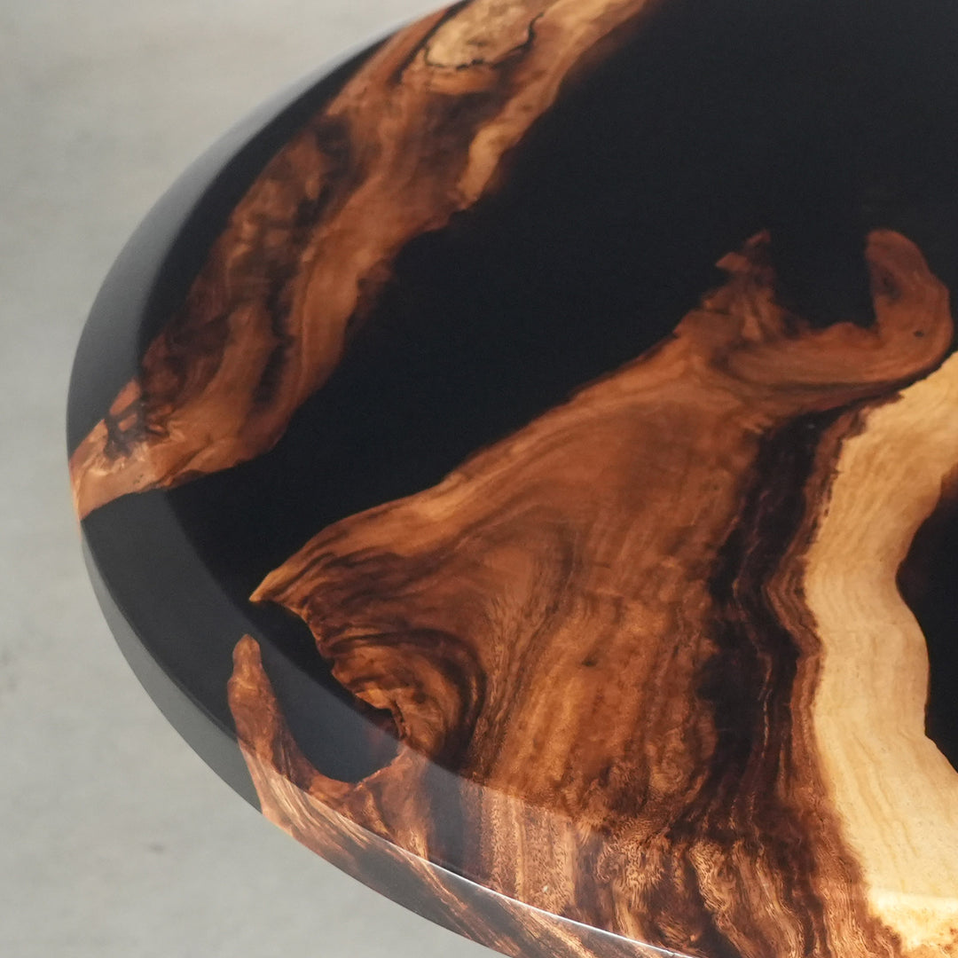 Contemporary round walnut resin coffee table with high-gloss black finish
