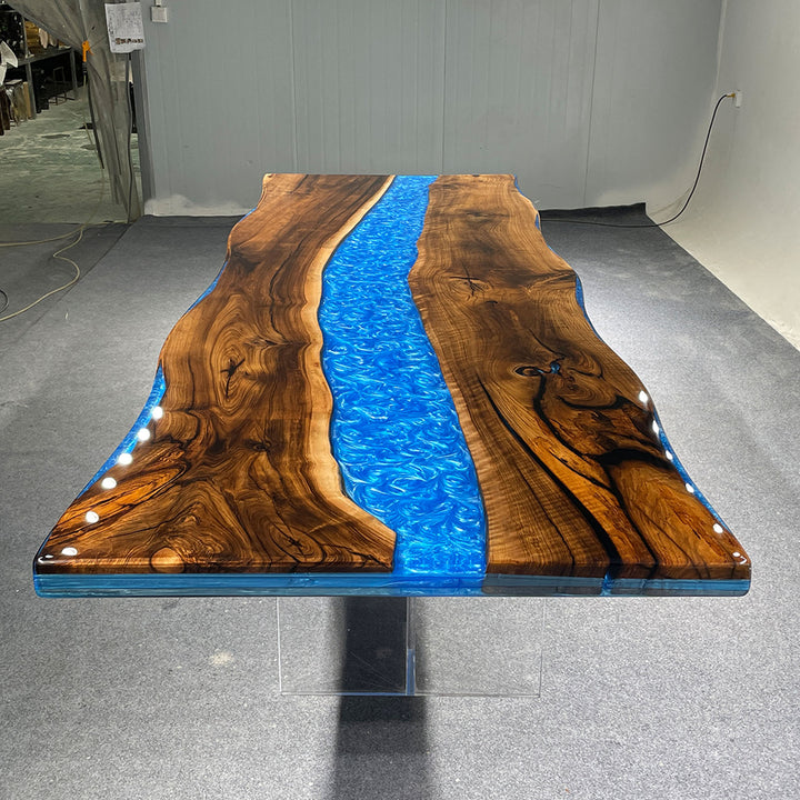 Statement walnut dining table with artistic blue resin river