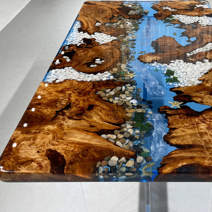 Beach house dining table with blue epoxy river and decorative stones