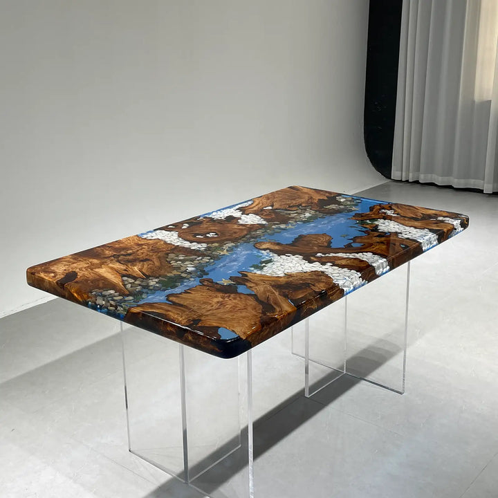 Blue resin river table with natural wood slabs and coastal decor accents