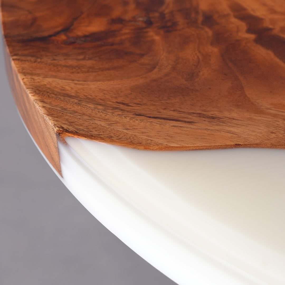 Close-up of Lunar Silk white resin blending with rich walnut wood grain