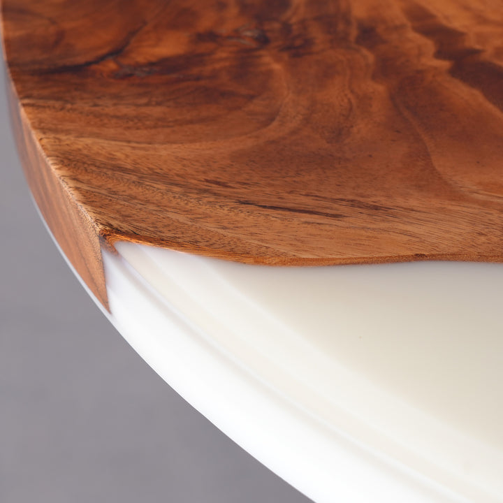 Close-up of Lunar Silk white resin blending with rich walnut wood grain