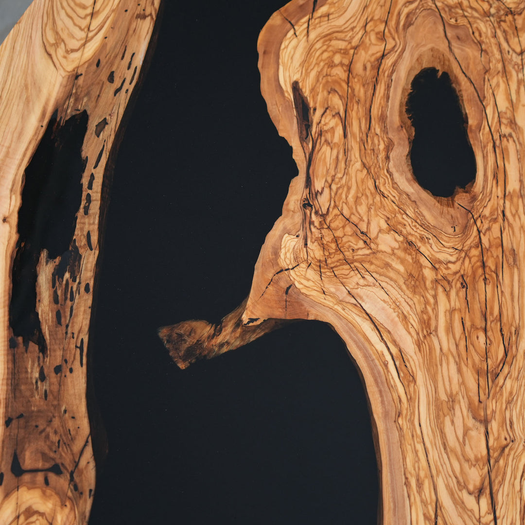 Detailed view of olive wood textures around black epoxy