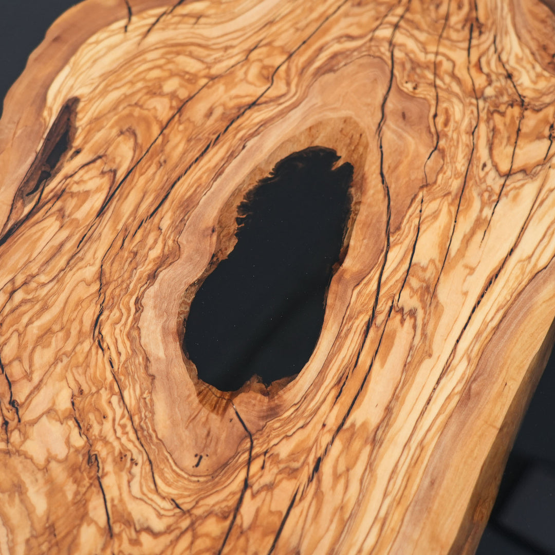 Close-up of olive wood grain and black epoxy center