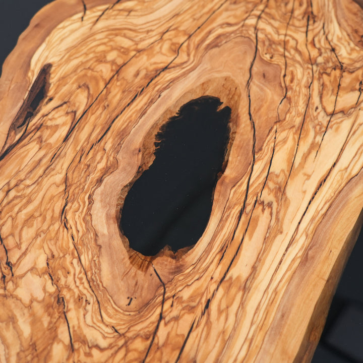 Close-up of olive wood grain and black epoxy center