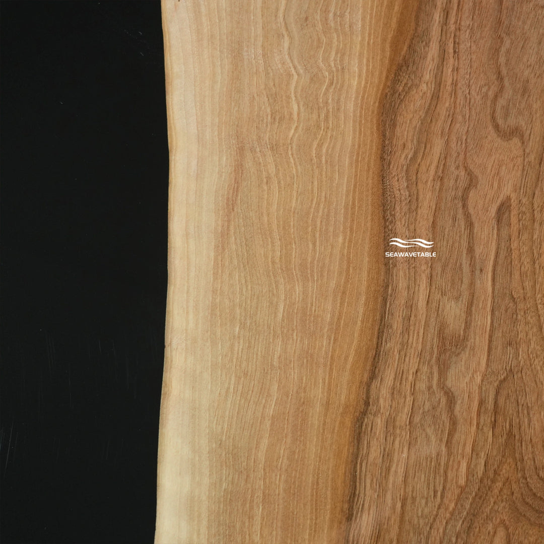 Macro detail of resin black walnut coffee table showing polished wooden coffee table top and artistic epoxy finish - SeaWaveTable