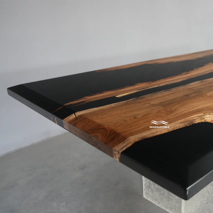 Close-up detail of black walnut epoxy table showing natural grain patterns and a seamless table with epoxy top finish - SeaWaveTable