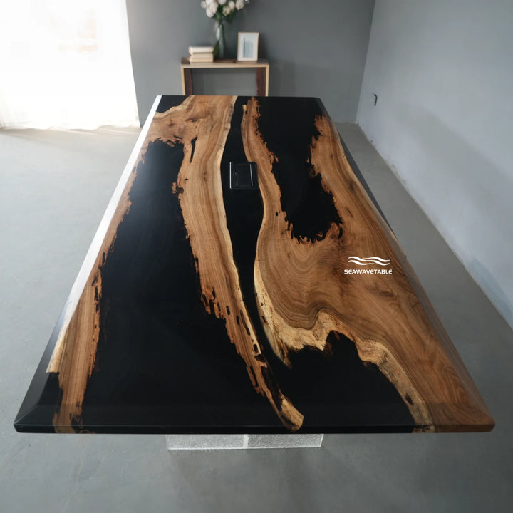 Exhibition view of a black walnut epoxy table showcasing a smooth table with epoxy top and power-outlet - SeaWaveTable