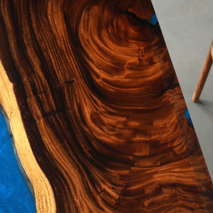 Walnut epoxy table detail highlighting the seamless resin connection, wood character, and premium dining room table quality - SeaWaveTable