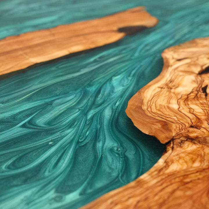 Artisan crafted olive wood table with ocean-inspired epoxy