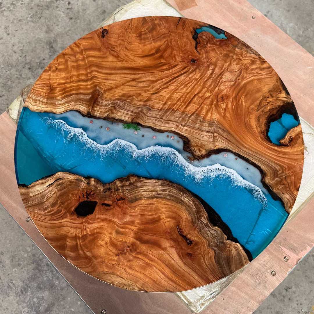 Handmade coastal round resin table with seashell accents and live edge wood