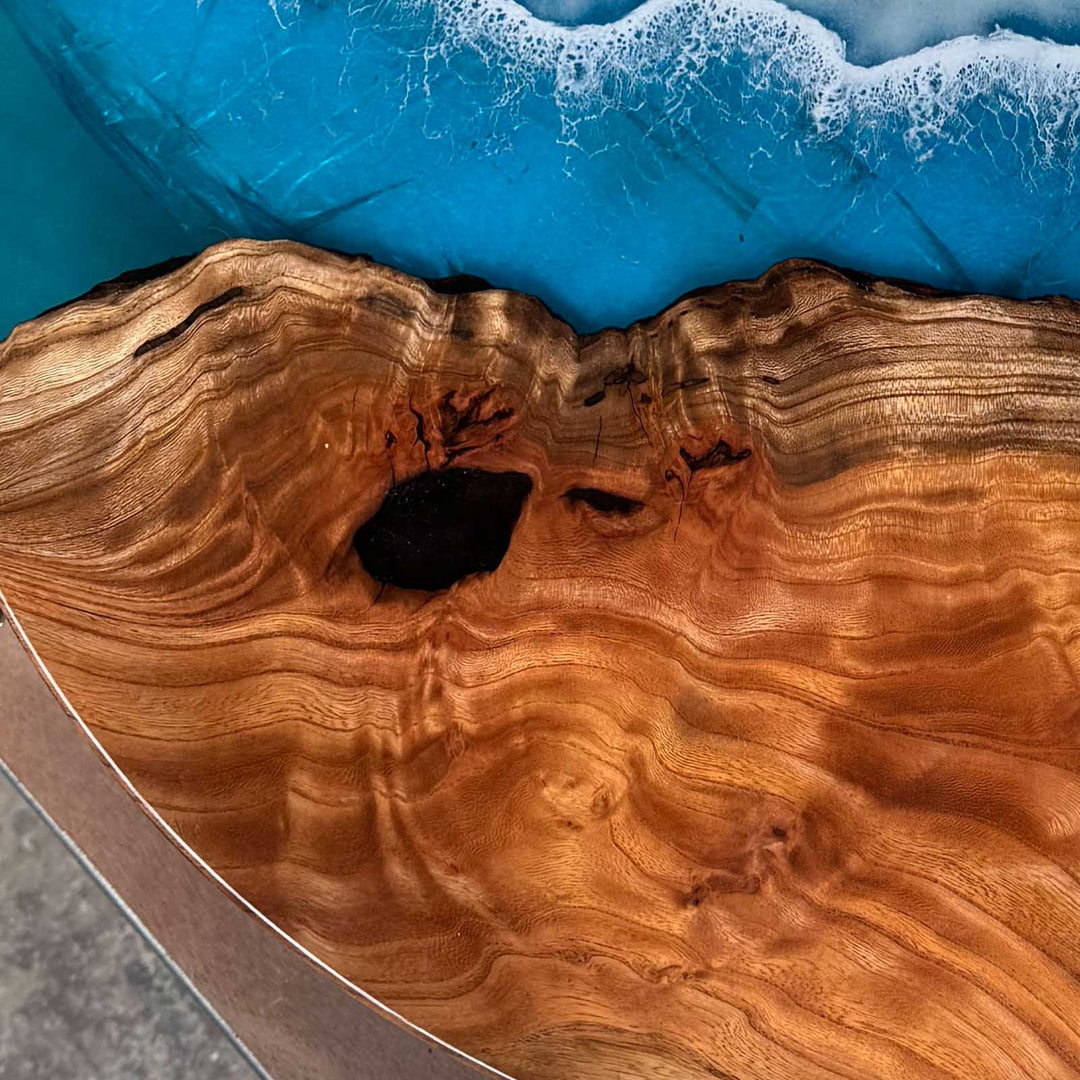 Round coastal resin table featuring handcrafted walnut wood grain