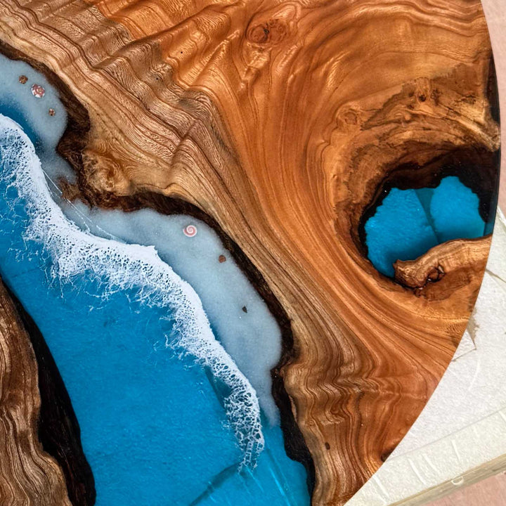 Artistic ocean wave epoxy table with embedded seashell decorations