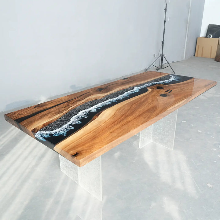Handcrafted solid wood dining table featuring a black resin river and wave design