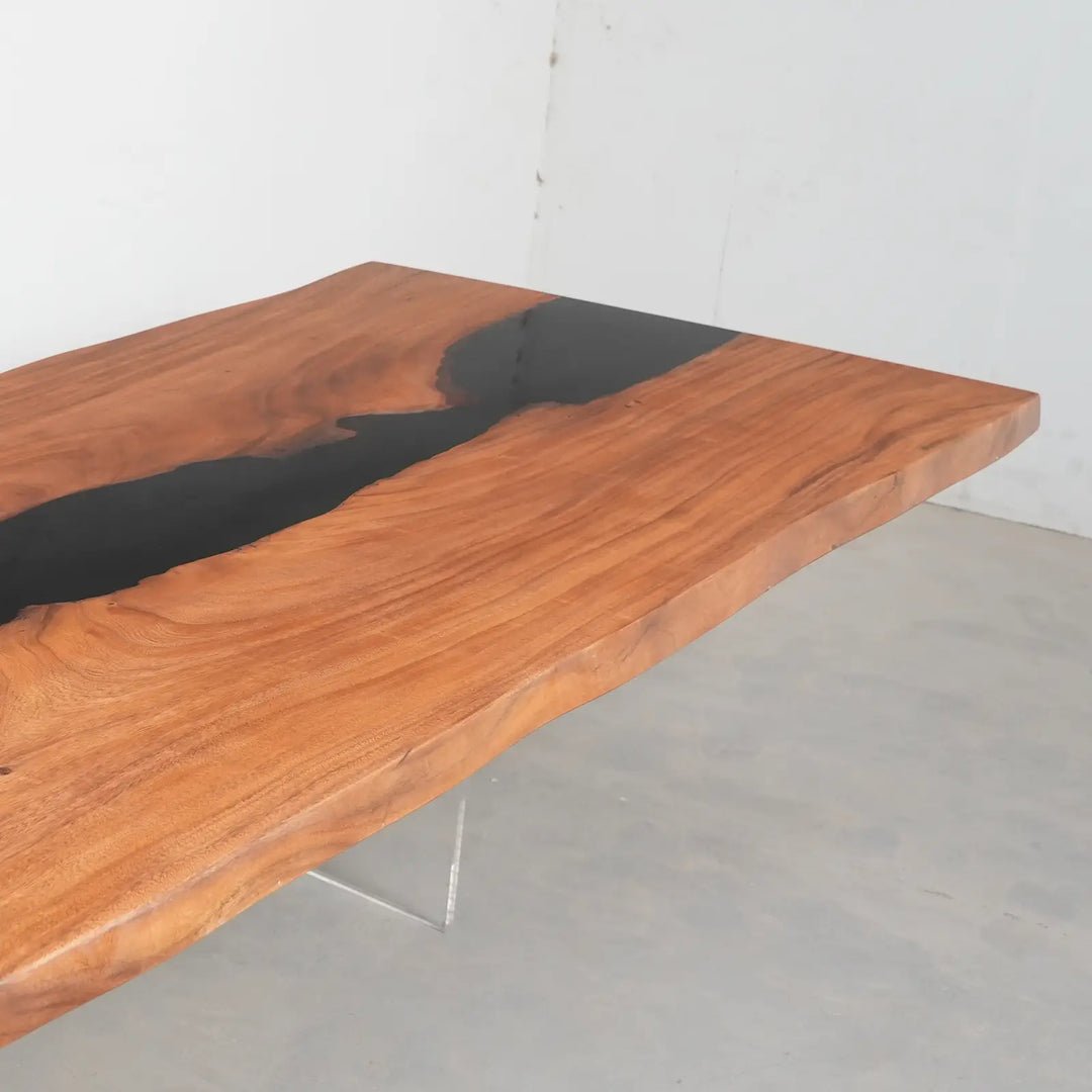 Black river epoxy walnut dining table in a modern coastal home
