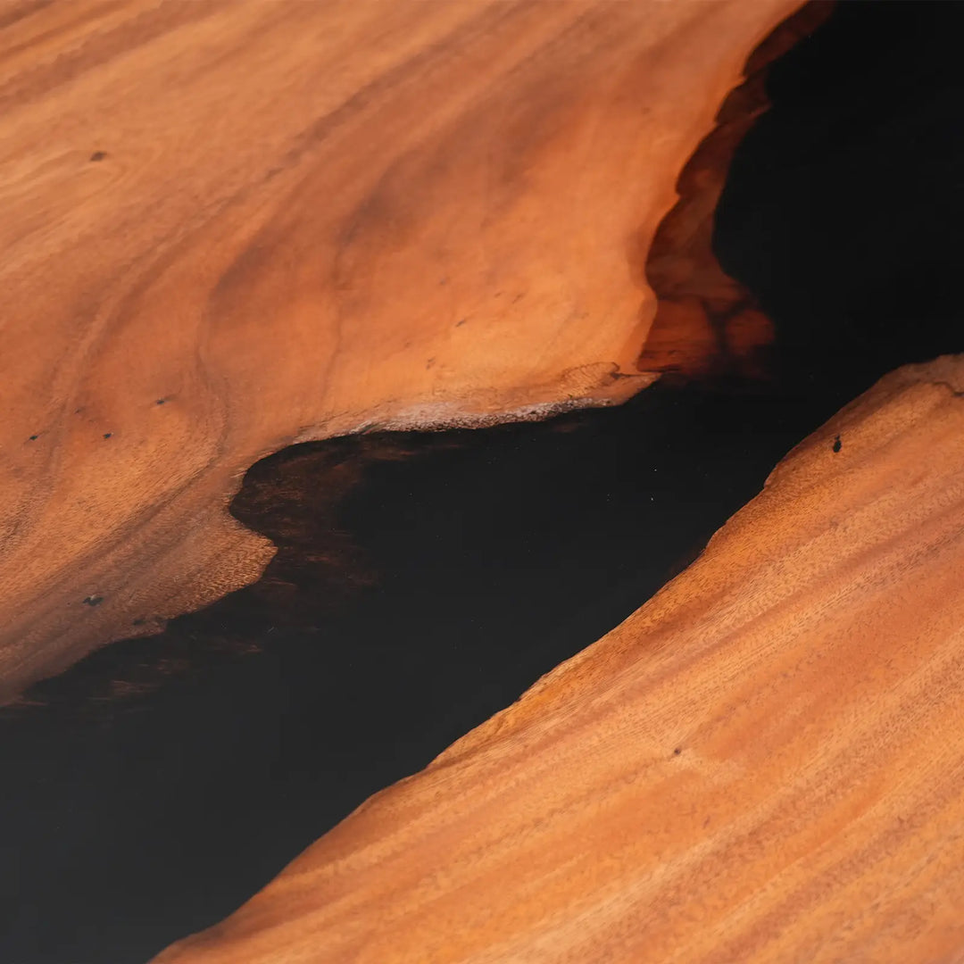 Close-up of natural walnut grain and black epoxy river on CRT-373
