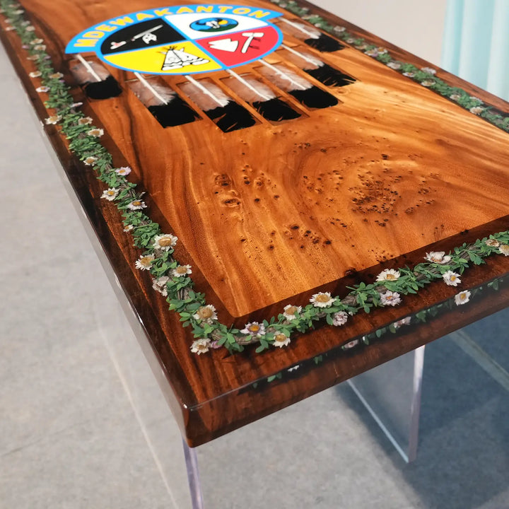 Unique handcrafted wood dining table with Southwestern-inspired decorative artwork