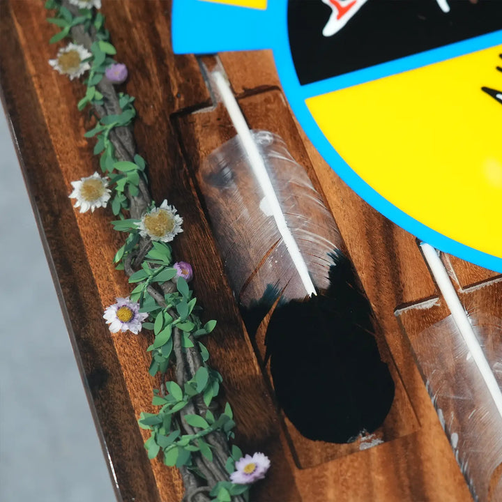 Artistic wood and resin dining table with decorative greenery and flower inlays