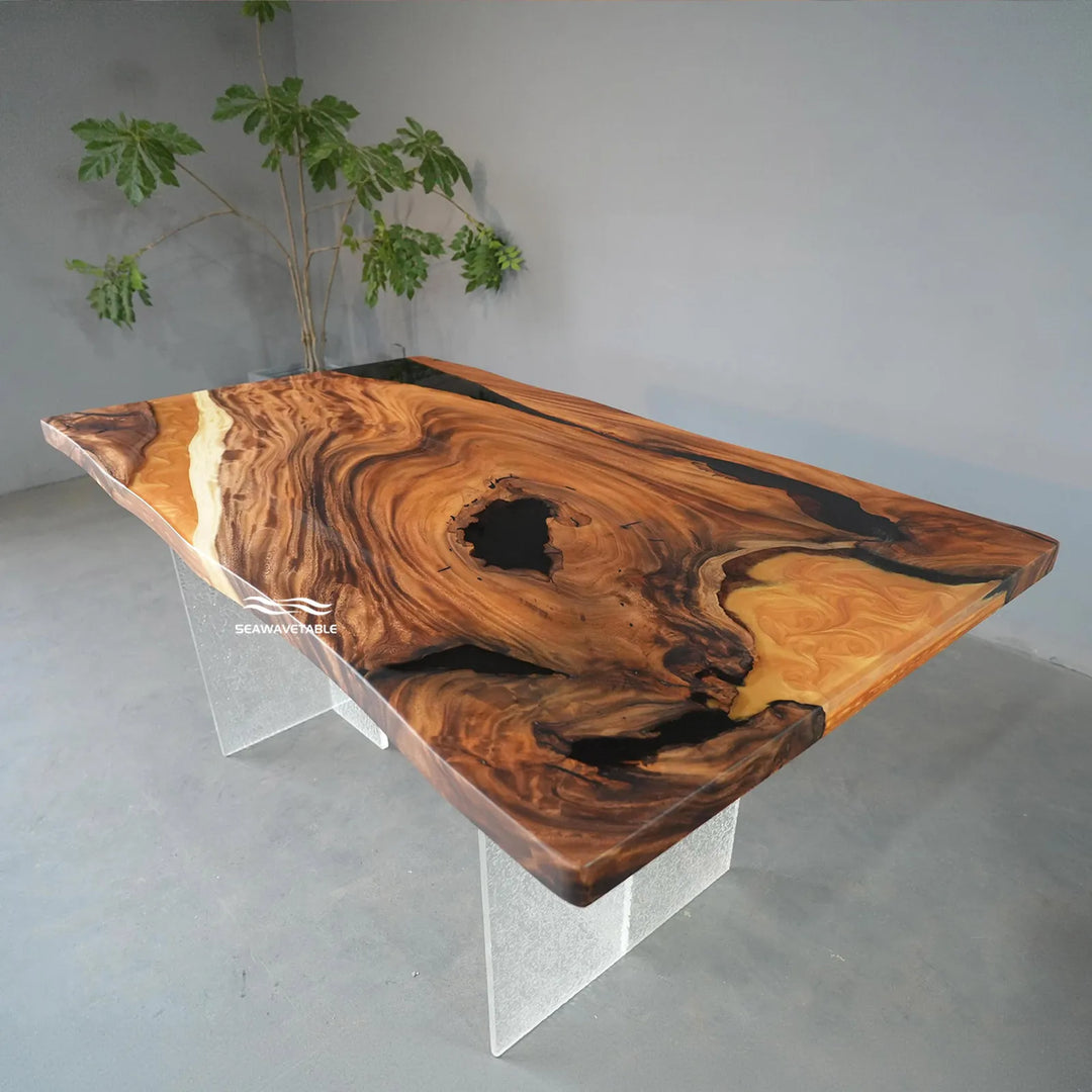 Contemporary live edge wood dining table with black resin voids and golden epoxy accents