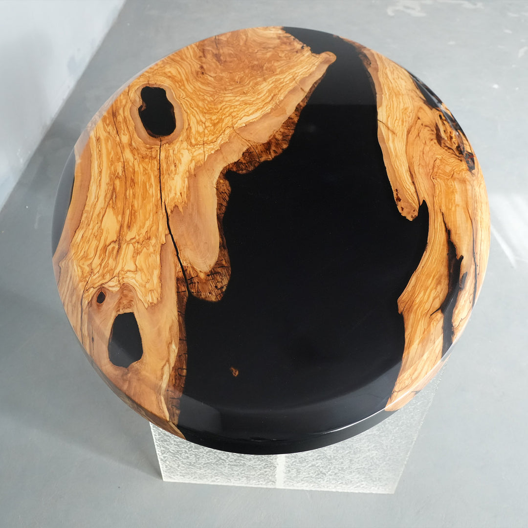 Modern black epoxy resin dining table with natural olive grain