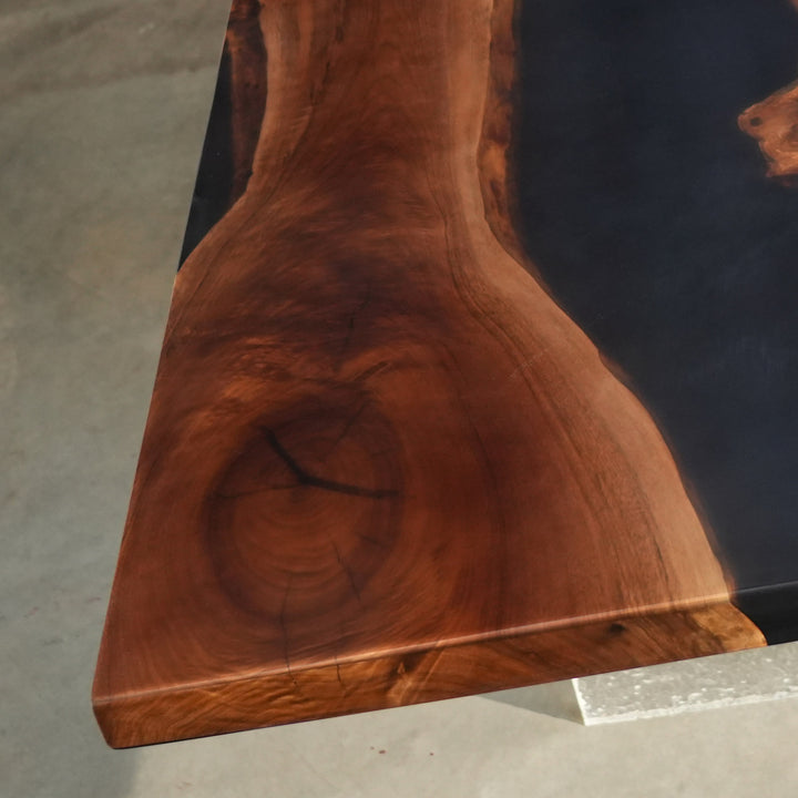 Custom Black Walnut epoxy table with bold dark resin contrast