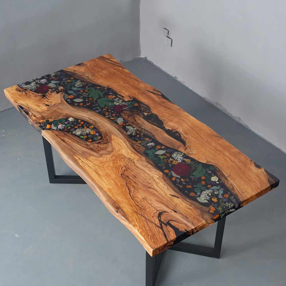 Epoxy river tabletop with natural olive wood and floral details
