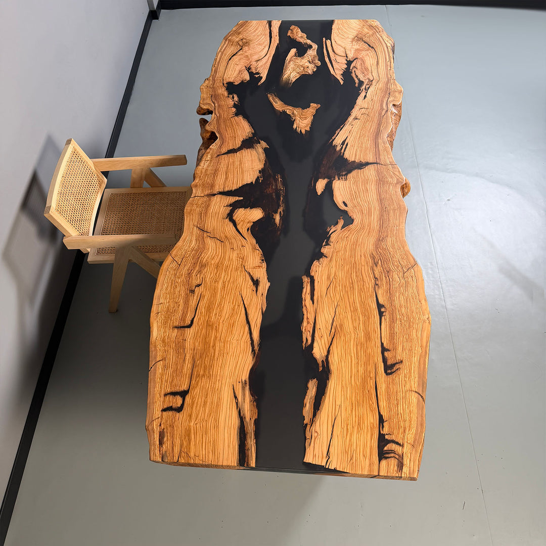 Live edge epoxy river table with black resin and natural wood grain
