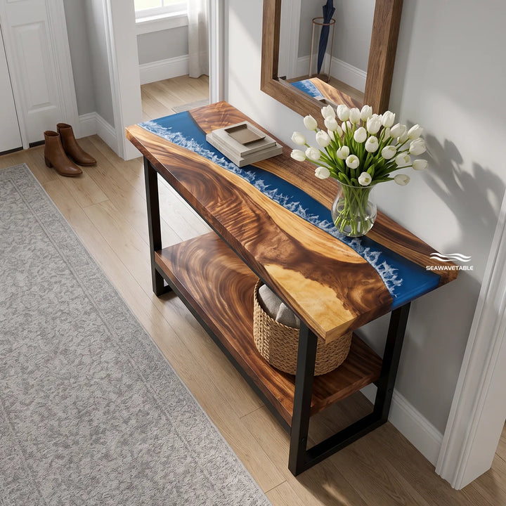 Custom solid wood console table featuring a walnut slab with translucent blue resin inlay and a double-layer design, styled in a modern hallway with soft natural light - SeawaveTable