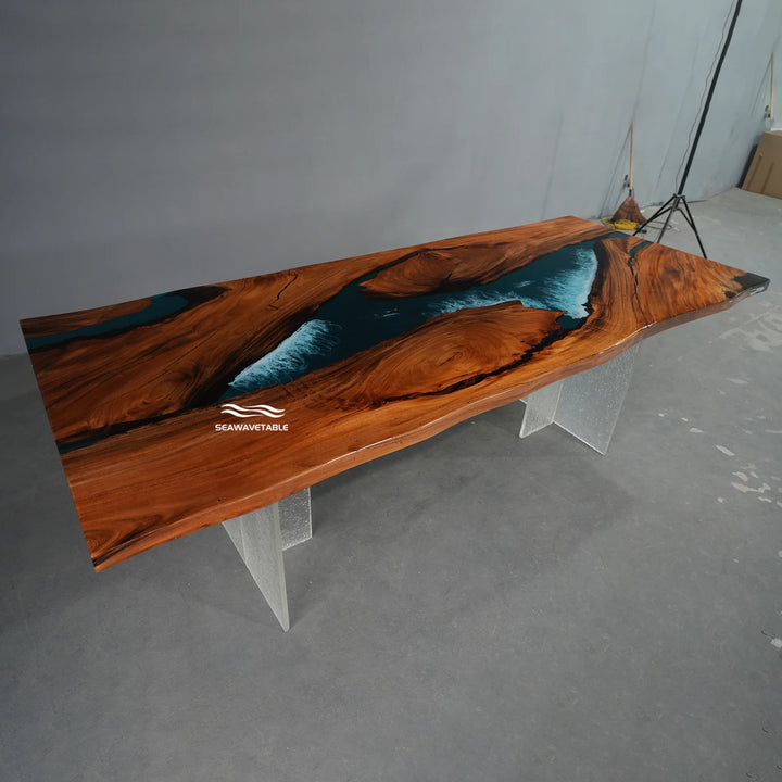 Walnut epoxy dining table exhibited in a professional showroom, highlighting the live-edge design, glossy blue resin river, and premium wood grain - SeawaveTable