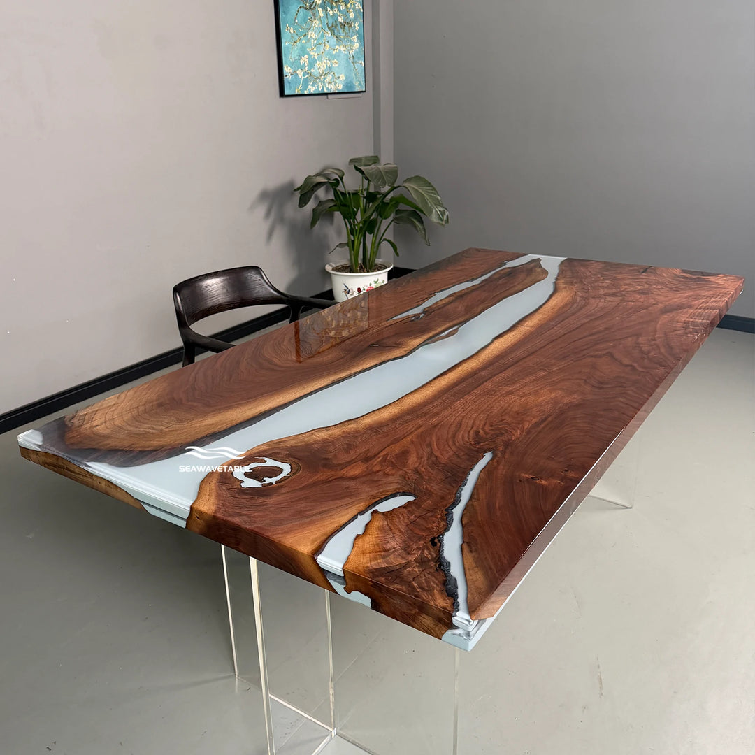 A resin dining table display featuring solid black walnut wood with a flowing white resin river, showcased in a bright studio setting for interior and exterior design presentation - SeawaveTable