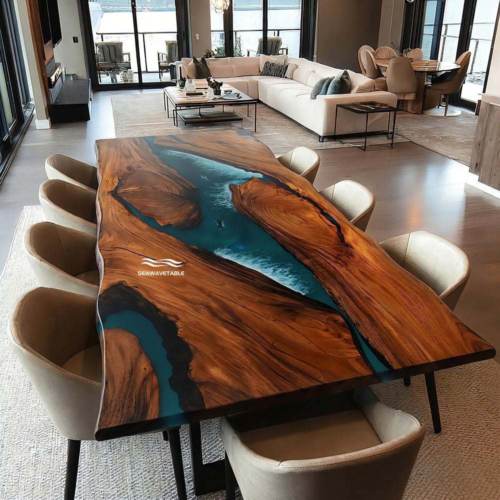 A handcrafted resin table with live-edge walnut and vivid blue resin river, positioned in an elegant modern living room with stylish upholstered chairs and natural light streaming through nearby windows - SeawaveTable