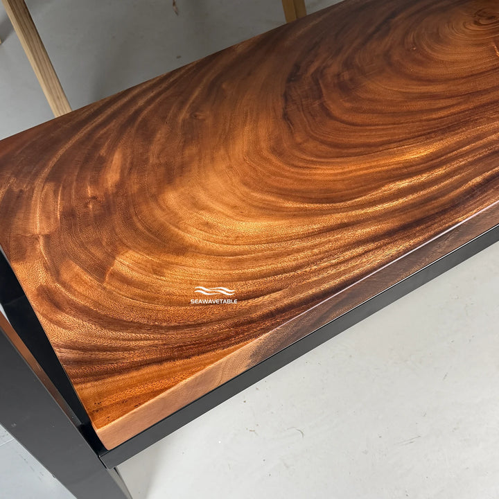 Close-up of a dual-layer console table showing the lower wooden shelf and the clean straight edge design of the walnut slab - SeawaveTable